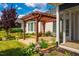 Landscaped yard features a pergola and flower beds at 237 Abercorn Cir, Chapel Hill, NC 27516