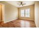 Bright bedroom with hardwood floors, ceiling fan, and double windows at 237 Abercorn Cir, Chapel Hill, NC 27516