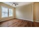 Spacious bedroom with hardwood floors, ceiling fan and well-lit with many windows at 237 Abercorn Cir, Chapel Hill, NC 27516