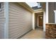 Exterior shot of home showing a covered walkway to the front door, stone accents and horizontal siding at 237 Abercorn Cir, Chapel Hill, NC 27516