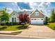 Charming home featuring a two-car garage, manicured lawn, and appealing curb appeal in a well-maintained neighborhood at 237 Abercorn Cir, Chapel Hill, NC 27516