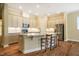Kitchen island with granite countertops, stainless appliances, and a breakfast bar with seating at 237 Abercorn Cir, Chapel Hill, NC 27516
