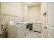 Functional laundry room with modern washer, dryer, sink and ample shelving for organized storage at 237 Abercorn Cir, Chapel Hill, NC 27516
