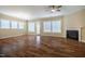 Living room features hardwood floors, neutral walls, natural light, and a modern fireplace at 237 Abercorn Cir, Chapel Hill, NC 27516