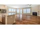 Open living space featuring hardwood floors, a fireplace, and a seamless transition to the kitchen at 237 Abercorn Cir, Chapel Hill, NC 27516