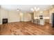 Spacious living area showcasing hardwood floors, a fireplace, and an open layout with kitchen views at 237 Abercorn Cir, Chapel Hill, NC 27516