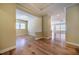 Open-concept living area with hardwood flooring, neutral walls, and lots of natural light at 237 Abercorn Cir, Chapel Hill, NC 27516