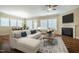 Comfortable living room with hardwood floors, a fireplace, and plush furniture at 237 Abercorn Cir, Chapel Hill, NC 27516