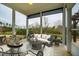 Relaxing screened-in porch is staged with outdoor furniture, providing an ideal space for relaxation and entertaining at 237 Abercorn Cir, Chapel Hill, NC 27516