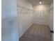 Walk-in closet with wire shelving and neutral carpeting at 237 Shingle Oak Rd, Wake Forest, NC 27587