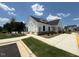 Community clubhouse featuring manicured landscaping and well maintained sidewalks at 237 Shingle Oak Rd, Wake Forest, NC 27587