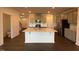 Modern kitchen boasts a kitchen island, stainless steel appliances, and sleek grey cabinets at 237 Shingle Oak Rd, Wake Forest, NC 27587