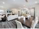 Bright open-concept living area with a fireplace, dining room, and kitchen at 237 Shingle Oak Rd, Wake Forest, NC 27587