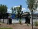 Community pool area with a blue water slide and surrounding trees at 237 Shingle Oak Rd, Wake Forest, NC 27587