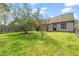 Spacious backyard featuring a well-maintained lawn, mature trees, and a partial fence for added privacy at 2416 Boothbay Ct, Raleigh, NC 27613