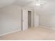 Neutral carpeted bedroom features a ceiling fan and closet at 2416 Boothbay Ct, Raleigh, NC 27613