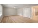 Open bedroom featuring a closet, window, ceiling fan, and access to the private en suite bath at 2416 Boothbay Ct, Raleigh, NC 27613