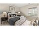Bedroom featuring a plush white bed, white trimmings, and a window overlooking the exterior at 2416 Boothbay Ct, Raleigh, NC 27613