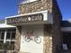 Exterior of SOLA Coffee Cafe featuring a stone facade and a charming bicycle decoration at 2416 Boothbay Ct, Raleigh, NC 27613