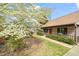 Quaint home featuring a well-manicured front yard and lush landscaping, complemented by a charming front porch at 2416 Boothbay Ct, Raleigh, NC 27613