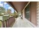 Spacious covered front porch with a neutral color scheme and views of a well-kept neighborhood at 2416 Boothbay Ct, Raleigh, NC 27613