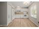 Efficient kitchen with white appliances and ample cabinet space at 2416 Boothbay Ct, Raleigh, NC 27613