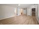 Open concept living room with wood floors and multiple entryways at 2416 Boothbay Ct, Raleigh, NC 27613