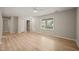 Spacious living room with wood floors, neutral walls and ceiling fan at 2416 Boothbay Ct, Raleigh, NC 27613