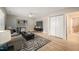 A cozy living room offers a ceiling fan, wood flooring, and neutral tones for a comfortable living space at 2416 Boothbay Ct, Raleigh, NC 27613