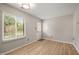 Bright living room featuring wood floors and a door to the outside at 2416 Boothbay Ct, Raleigh, NC 27613