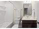 Clean bathroom featuring a shower-tub combo, a white porcelain toilet, and a framed vanity mirror at 248 Shingle Oak Rd, Wake Forest, NC 27587