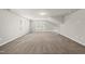 A spacious carpeted bonus room with natural light and a sloped ceiling at 248 Shingle Oak Rd, Wake Forest, NC 27587