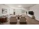 Staged carpeted bonus room with lots of sunlight, a sofa, chairs, and TV at 248 Shingle Oak Rd, Wake Forest, NC 27587