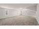 Spacious bonus room with neutral carpet, three windows, and plenty of natural light at 248 Shingle Oak Rd, Wake Forest, NC 27587