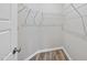 Walk-in closet with white wire shelving and laminate flooring provides ample storage space at 248 Shingle Oak Rd, Wake Forest, NC 27587
