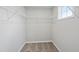 Walk-in closet with bright light and white wire shelving provides ample storage at 248 Shingle Oak Rd, Wake Forest, NC 27587