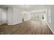 Bright, spacious living room with wood-look floors, neutral paint, and abundant natural light at 248 Shingle Oak Rd, Wake Forest, NC 27587