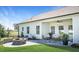 Inviting backyard with a covered patio, outdoor seating, a fire pit, and a landscaped yard at 249 Spilona Way # 64, Four Oaks, NC 27524