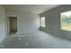 A bedroom features an abundance of natural light with two large windows and a neutral color scheme at 249 Spilona Way # 64, Four Oaks, NC 27524