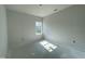 An unfinished bedroom offers possibilities with its window and ample space at 249 Spilona Way # 64, Four Oaks, NC 27524