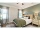 Cozy bedroom with neutral tones, a large window for natural light, and stylish decor at 249 Spilona Way # 64, Four Oaks, NC 27524