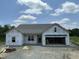 New construction home featuring an open garage, gray roof, and bright natural light at 249 Spilona Way # 64, Four Oaks, NC 27524