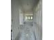 Bright hallway leading to the living area, showcasing the home's spacious layout and natural light at 249 Spilona Way # 64, Four Oaks, NC 27524