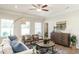Tastefully decorated living room with stylish furniture, a ceiling fan, and a view of the outdoors at 249 Spilona Way # 64, Four Oaks, NC 27524