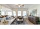Bright and airy living room featuring modern furniture, hardwood floors, and plenty of natural light at 249 Spilona Way # 64, Four Oaks, NC 27524