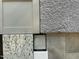 Close-up of home design materials showcasing carpet, tile, countertop, and cabinet samples at 249 Spilona Way # 64, Four Oaks, NC 27524