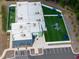 Aerial view of daycare with modern facilities, playground, turfed areas and lots of safety features at 249 Wendover Pkwy, Pittsboro, NC 27312