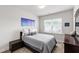 Comfortable bedroom features a single bed and a picturesque window view of the outdoors at 249 Wendover Pkwy, Pittsboro, NC 27312