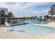 A sparkling community pool with lounge chairs and a play area, perfect for Gathering fun and relaxation on sunny days at 249 Wendover Pkwy, Pittsboro, NC 27312