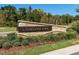 Attractive stone community sign amidst lush landscaping and manicured lawn, welcoming visitors at 249 Wendover Pkwy, Pittsboro, NC 27312